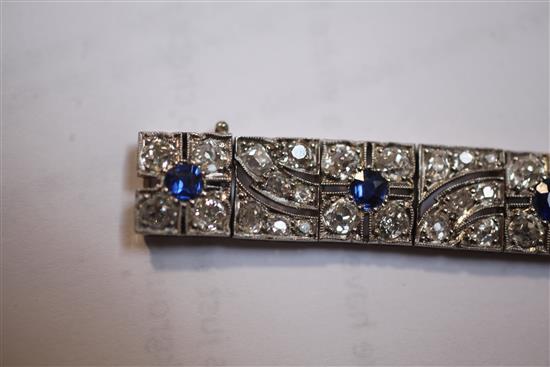 An attractive 1920s pierced white gold, sapphire and diamond bracelet, 18cm.